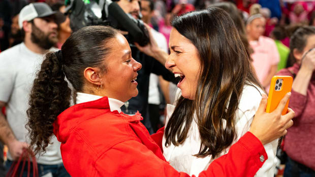 Feb 11, 2024; Lincoln, Nebraska, USA; Nebraska Cornhuskers head coach Amy Williams celebrates with her daughter Kennadi after defeating the Iowa Hawkeyes at Pinnacle Bank Arena.